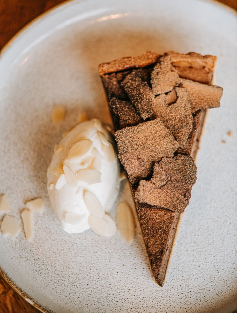 Dessert plate with chocolate tart and cream
