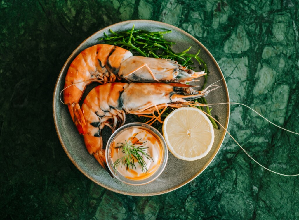 Seafood dish with prawns served on a rustic plate at Tide House Whitstable