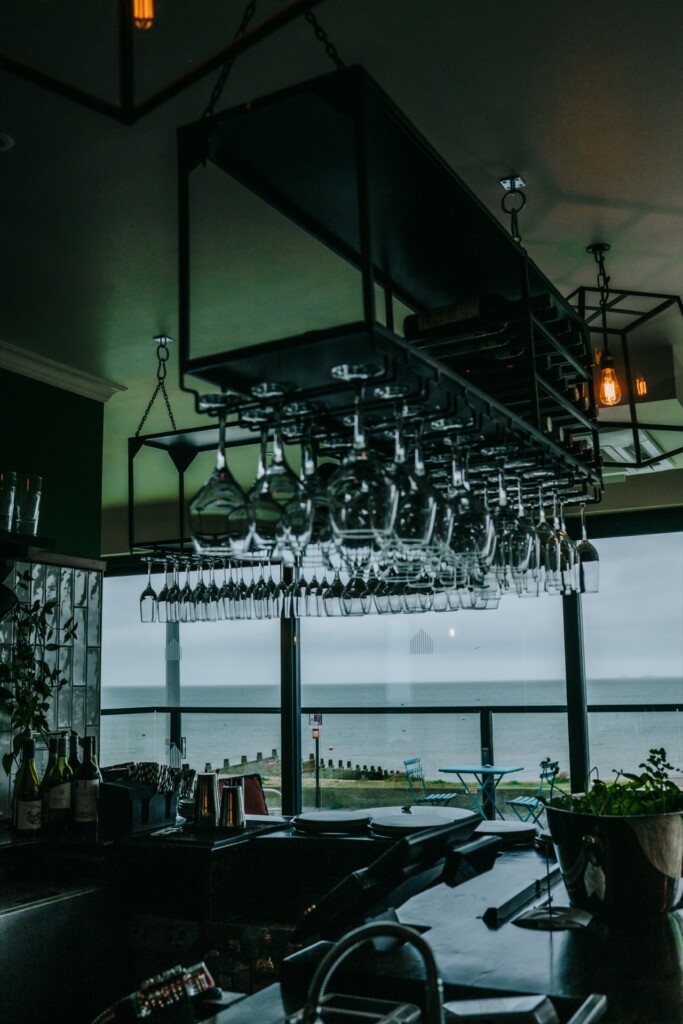 Wine glasses hanging over the bar area of Tidehouse