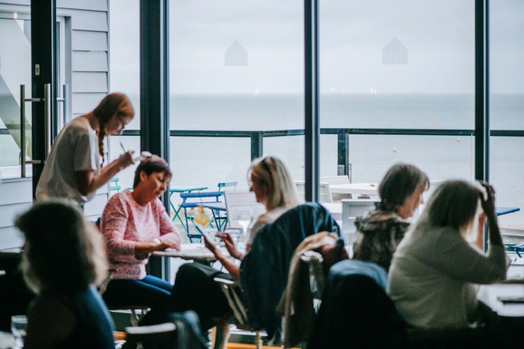 Guests enjoying lunch and drinks inside Tide House Whitstable