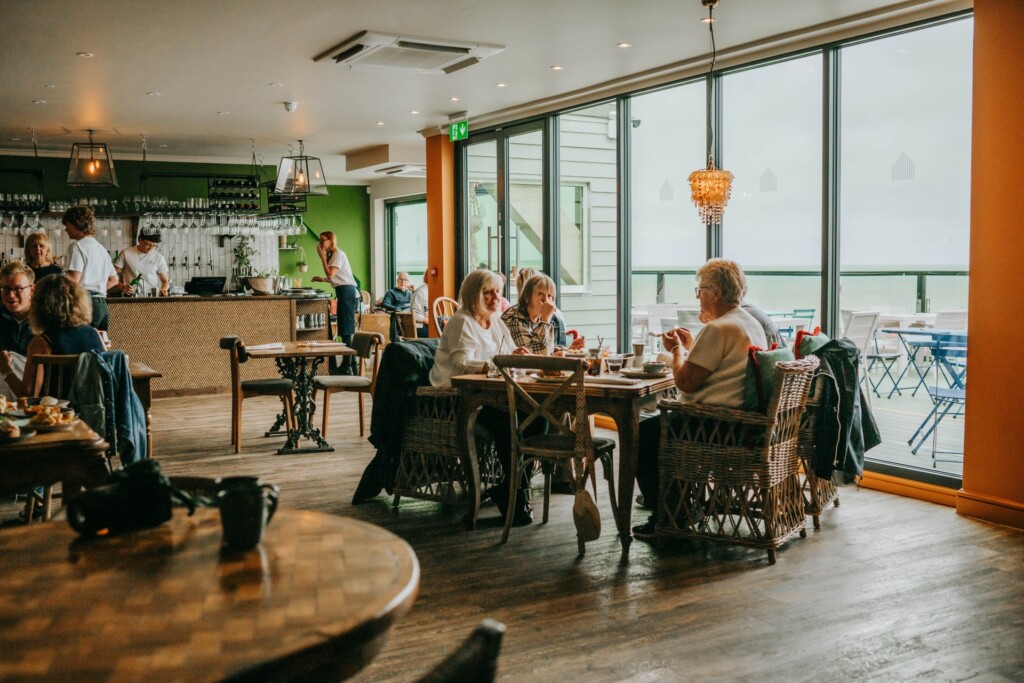 Guests enjoying lunch and drinks inside Tide House Whitstable