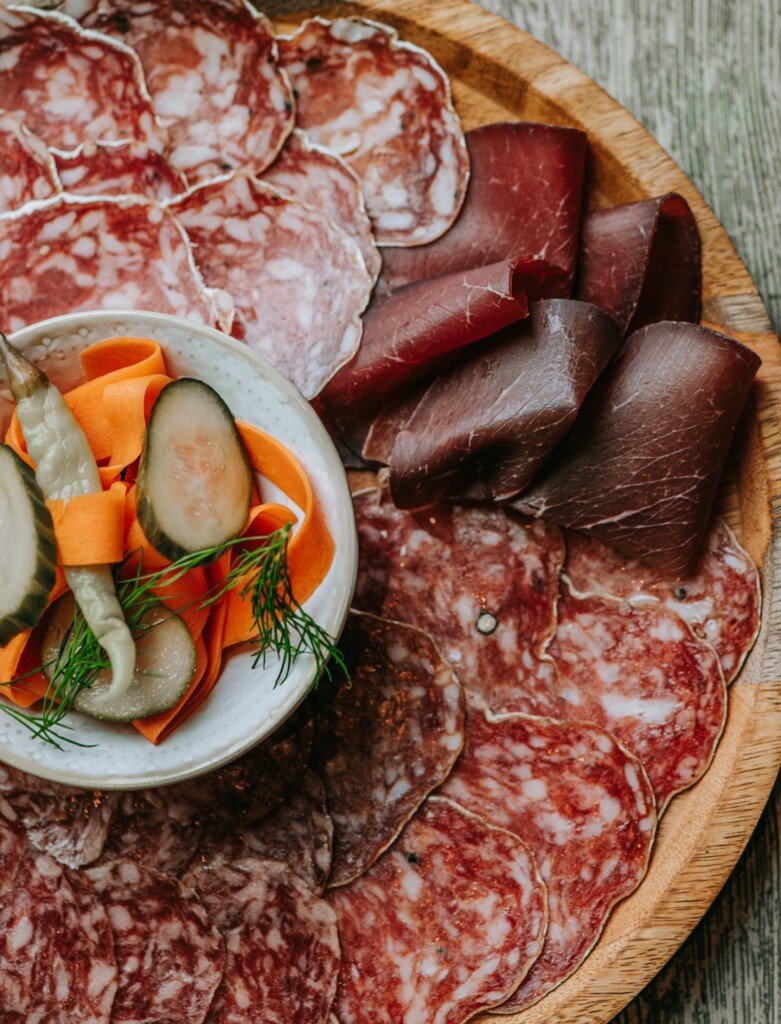 Charcuterie board with cured meats and pickles at Tidehouse